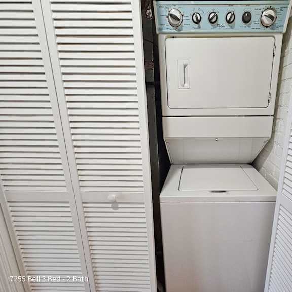 a white washer and dryer in a small room