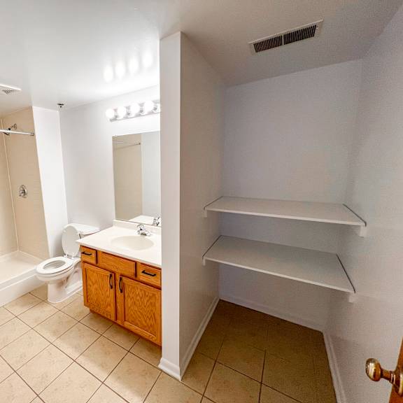 a bathroom with a toilet, sink, and a bathtub.