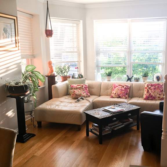a living room with a white couch and a coffee table.