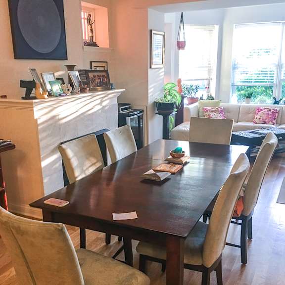 a dining room with a wooden table and chairs.