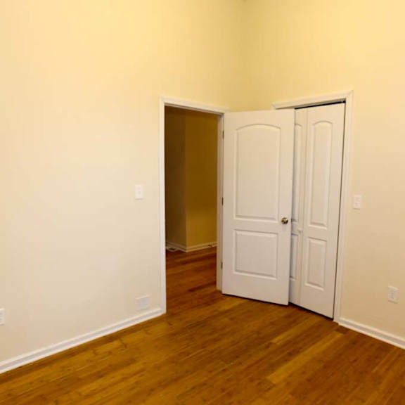 a room with a white door and a brown door.