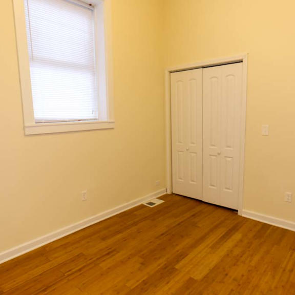 a room with a white door and a window.