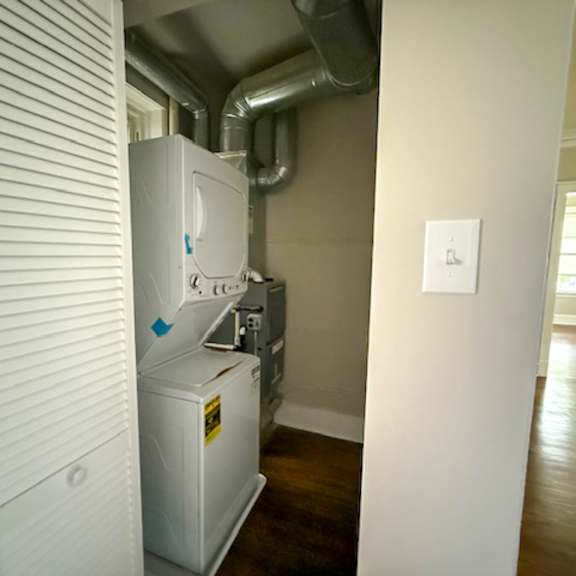 a white wall-mounted heater is next to a white wall.