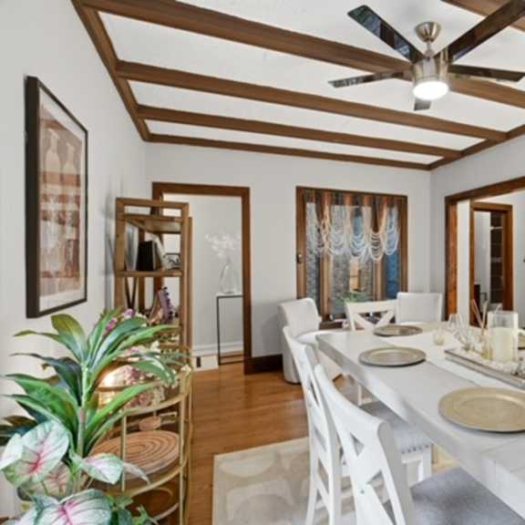 a dining room with a long table set for a meal.