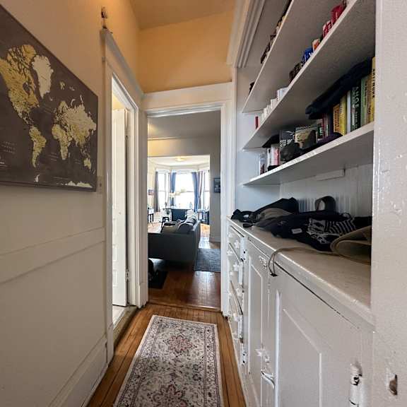 a hallway with a world map on the wall.