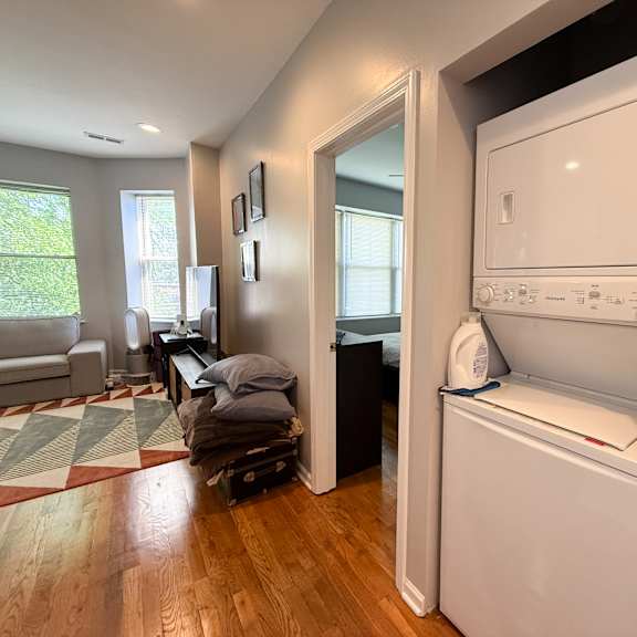 a white dishwasher is built into a wall in a kitchen.