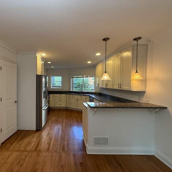 a kitchen with a counter and cabinets.