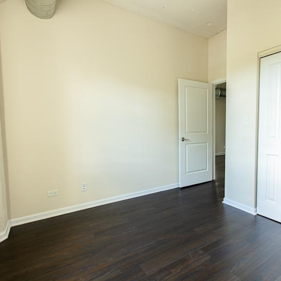 a room with a white door and a white wall.