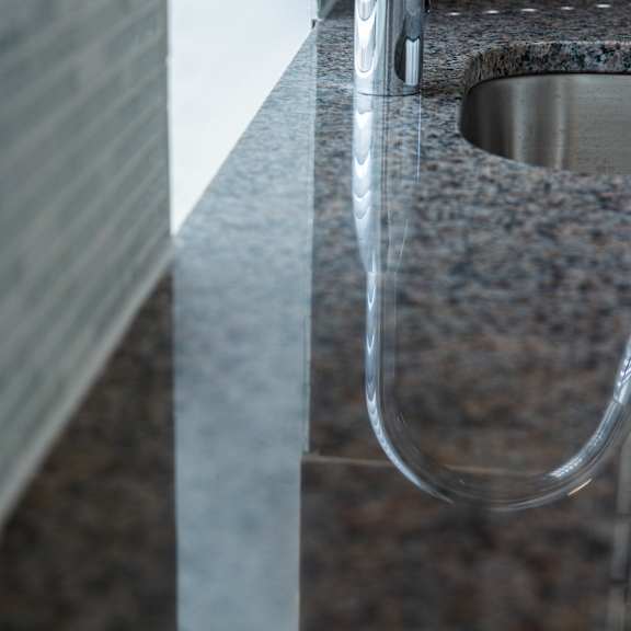 a close up of a sink with a faucet.
