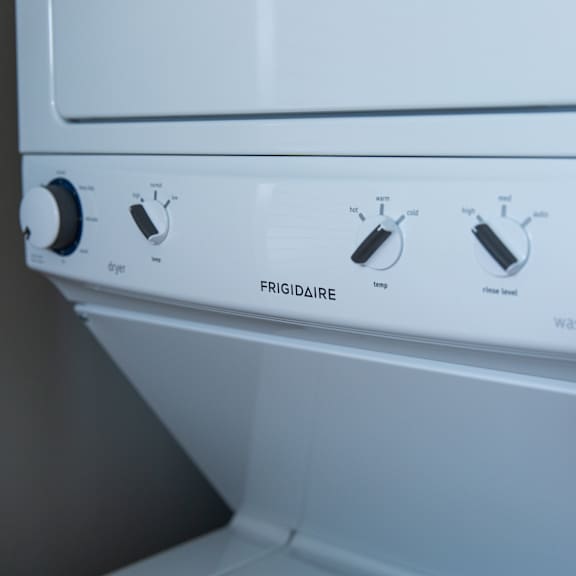 a white washing machine with the control panel showing.