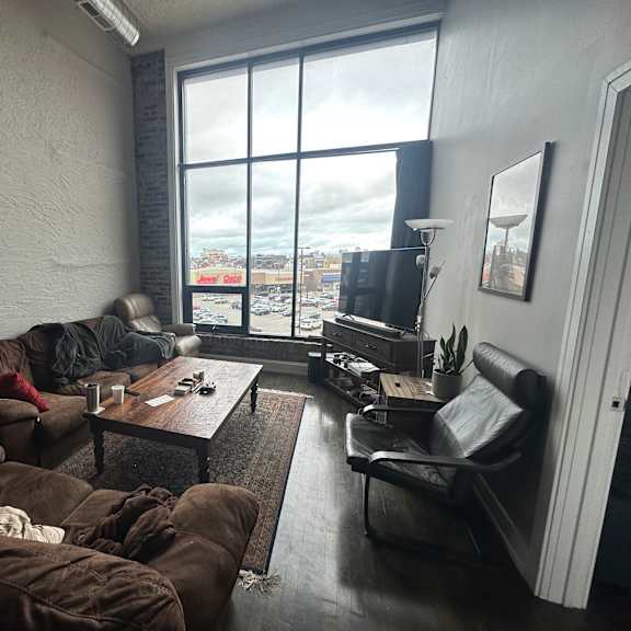a living room with a couch, chair, and coffee table.