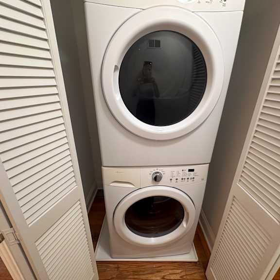 a person is standing inside a washing machine.