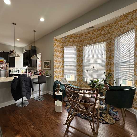 a kitchen with a dining table and chairs.