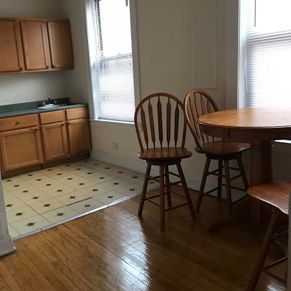 a kitchen with wooden floors and a checkered floor.