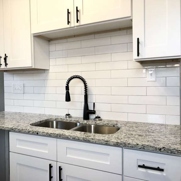 a kitchen with a sink and a counter.