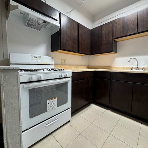 a stainless steel oven with a glass door is in the foreground of the image.