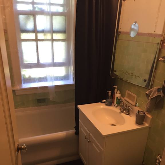 a bathroom with a sink and a toilet and a mirror