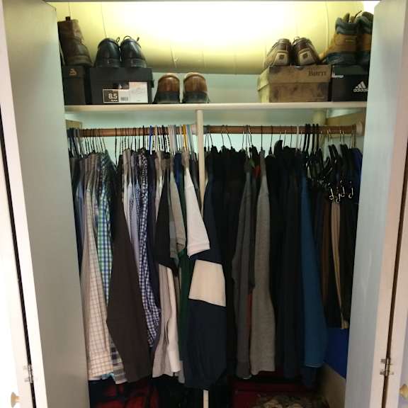 a closet full of clothes and shoes.