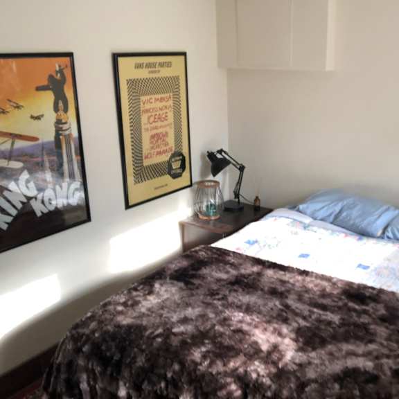 a poster with a man on it is hanging on the wall.