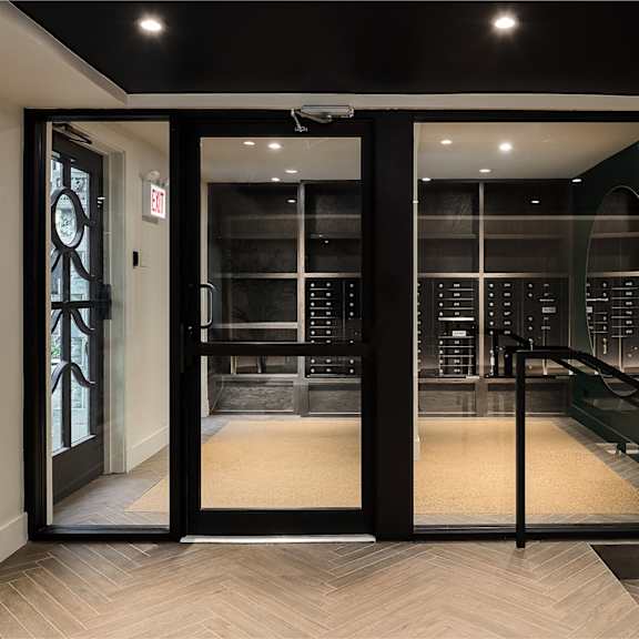 a large glass door leading to a wine room in a building