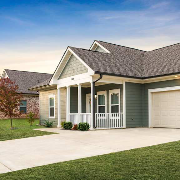 a house with a driveway and a garage door