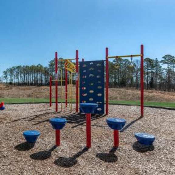 a playground with a swing set and other playground equipment
