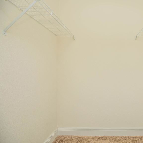 a room with white walls and a carpeted floor. at the cove at state street apartments, louisiana