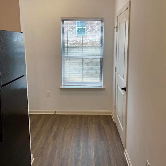 a living room with a window and a door