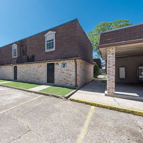 a parking lot with a building on the right.