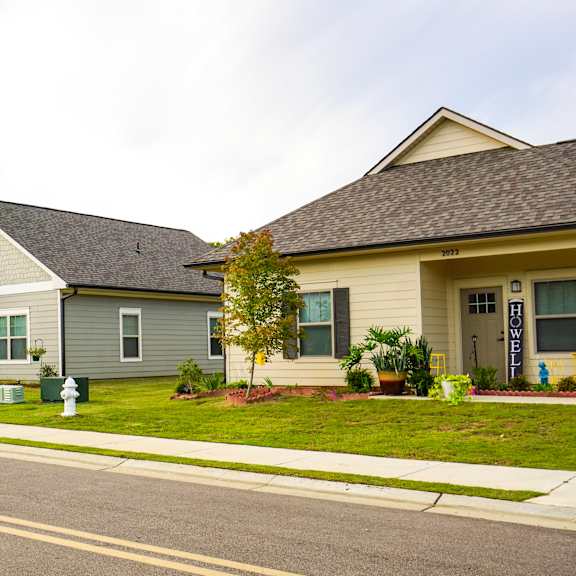 a row of houses on the side of a street