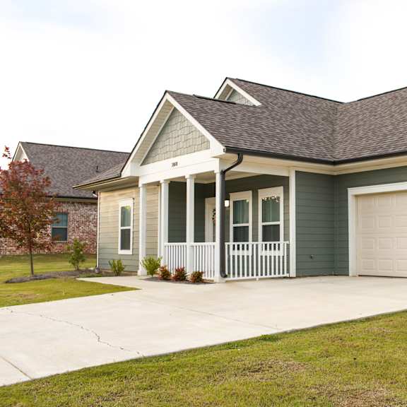 a house with a driveway and a garage door