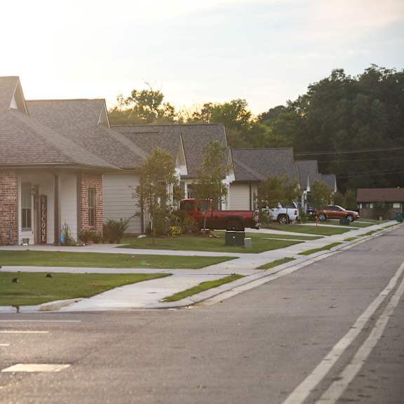 a row of houses on the side of a street