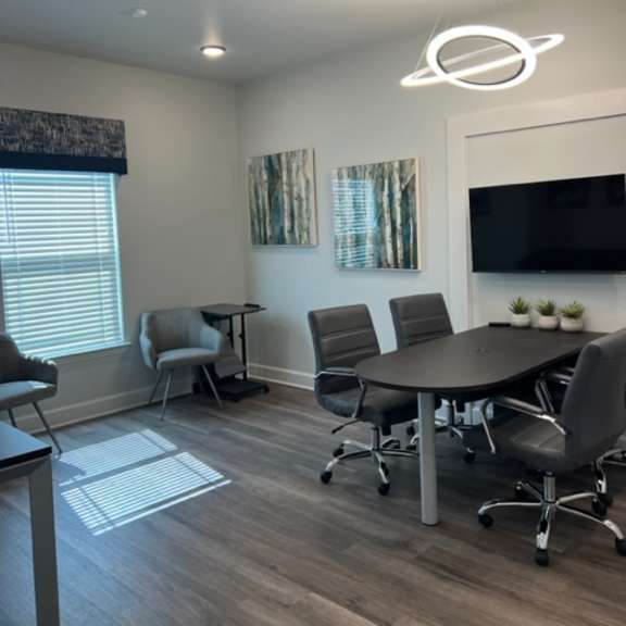 a modern office space with a wooden floor and a white ceiling.