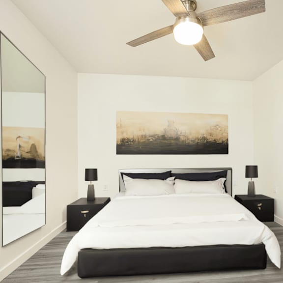 a bedroom with a large bed and a painting on the wall.