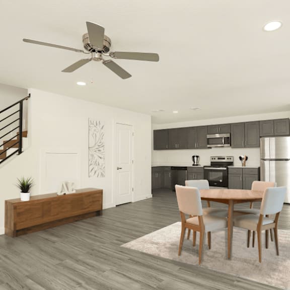 a modern dining room with a wooden table and chairs.
