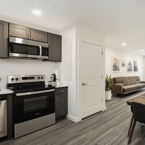 a modern kitchen with a dining table and chairs.
