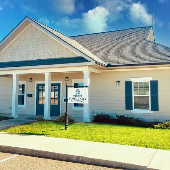 a small building with a sign that says community center.