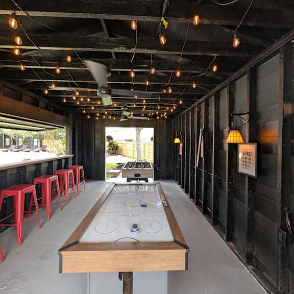 a long table with a bench in the middle of it.