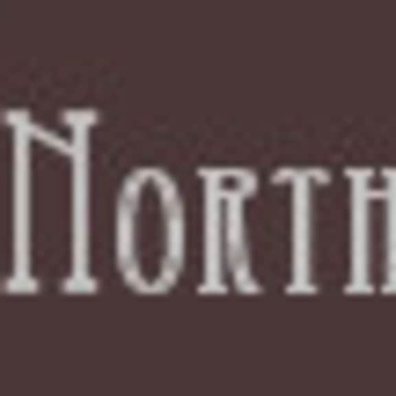 the image displays the text "northshore villas" in a serif font on a brown background.