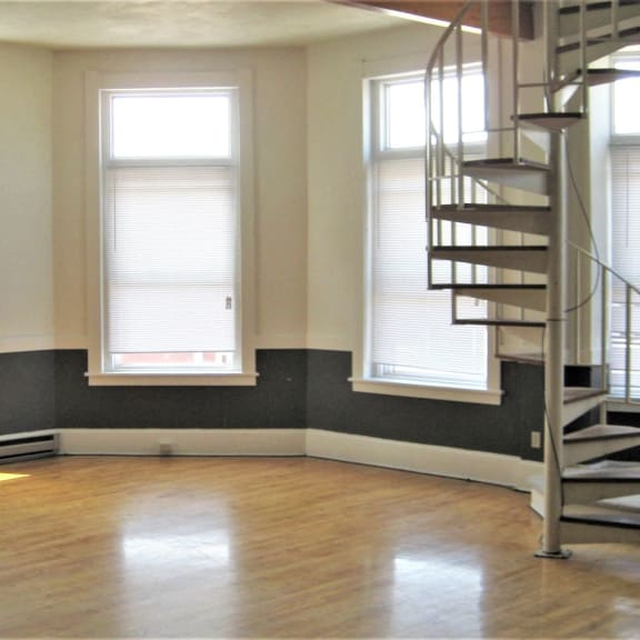 apartment 301 | 1 br | living area | spiral staircase | three sixty real estate