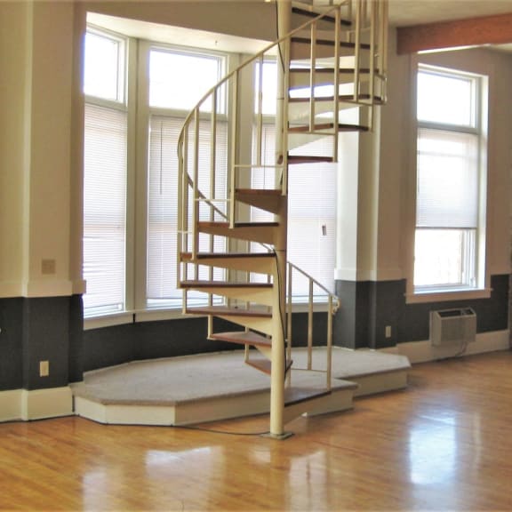 apartment 301 | 1 br | living area | spiral staircase | three sixty real estate
