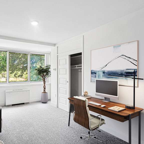Thumbnail 13 of 13 a home office with a desk and a window