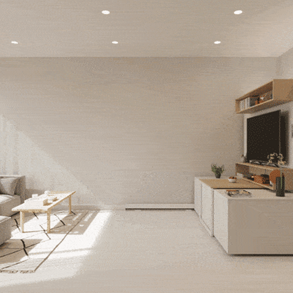 Thumbnail 2 of 5 A modern living room with a grey couch, a wooden coffee table, and a white cabinet with a TV on top.