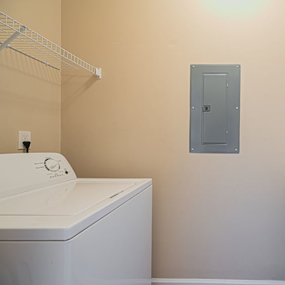 a washer and dryer in a laundry room with a door