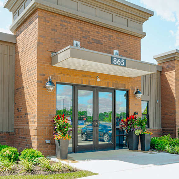 the front of a building with glass doors