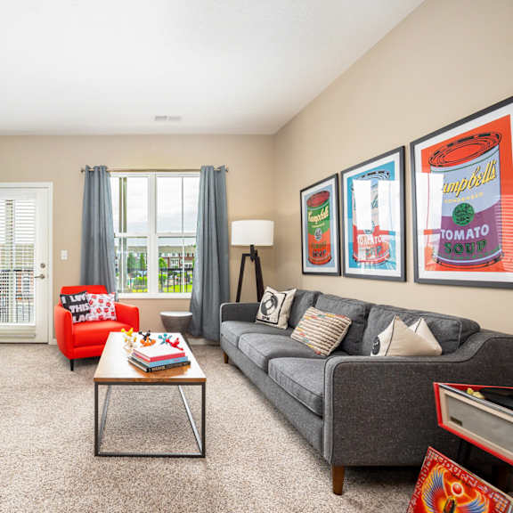 a living room with a couch and a coffee table and a television