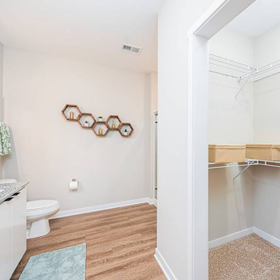 a bathroom with a shower and a sink and a toilet