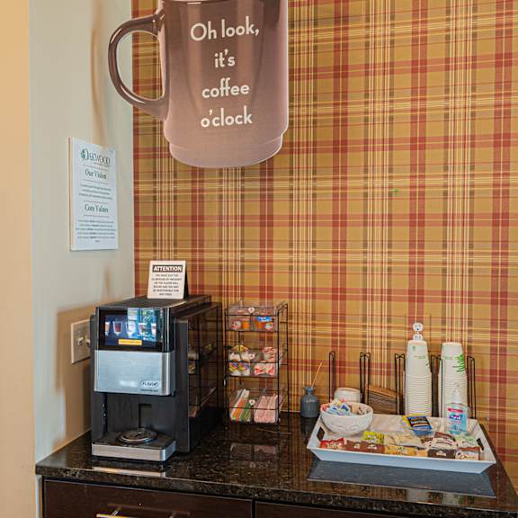 a coffee shop with a coffee cup on the wall