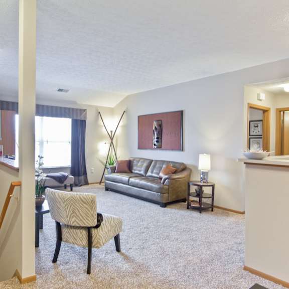 a living room with a couch and a chair
