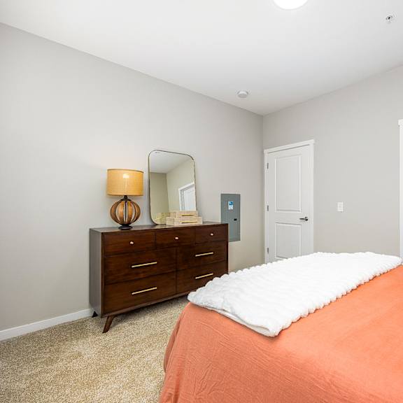 the preserve at ballantyne commons bedroom with bed and dresser